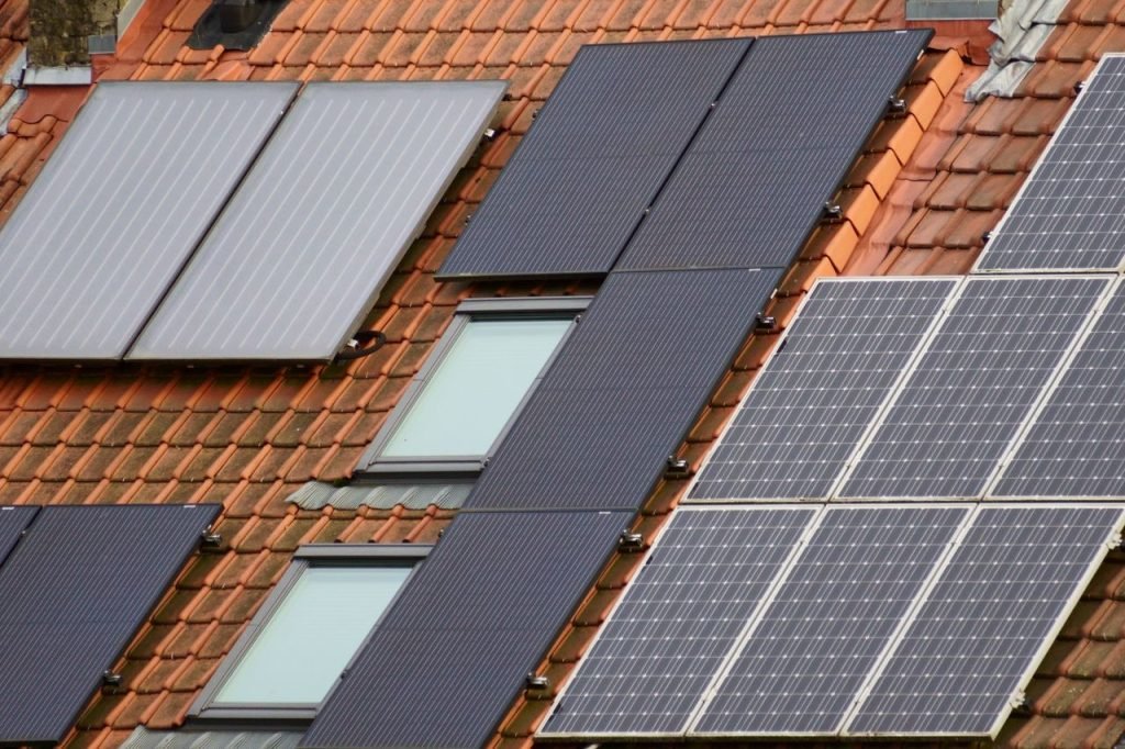 efficient-rooftop-solar-panel-installation-30440447 Close-up of solar panels on a tiled roof, showcasing sustainable energy solutions.